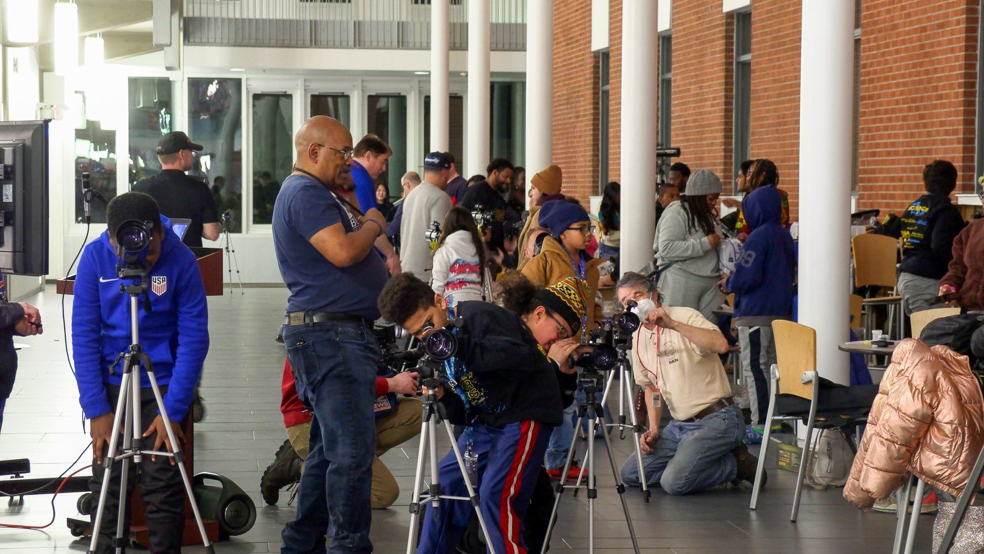Students and families set up their telescopes at the Stellar Dreams kickoff in Buffalo